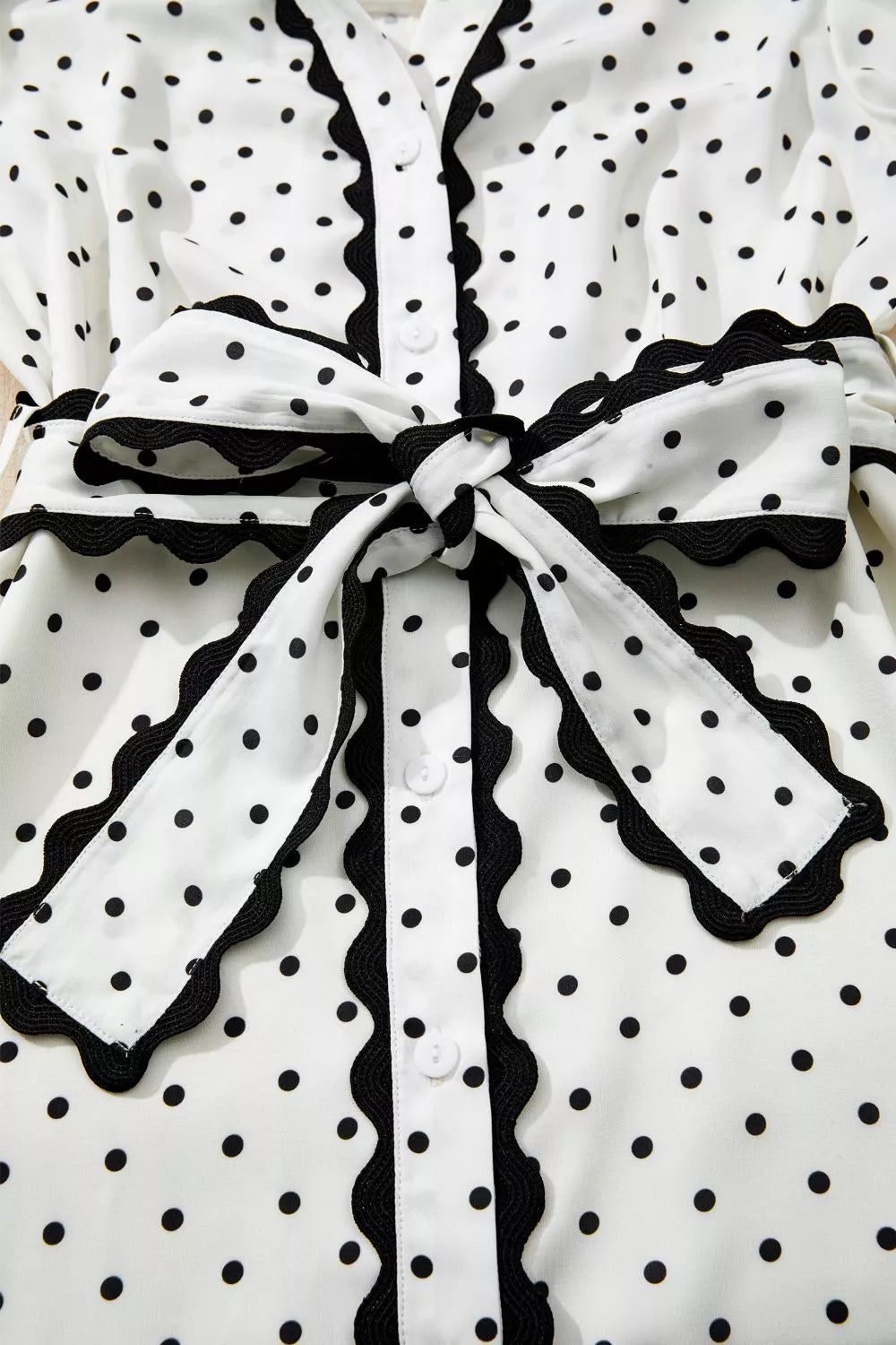 Cedar & Moore Polka Dot Half Sleeve Midi Dress, white with black dots, belted bow waist, buttoned front