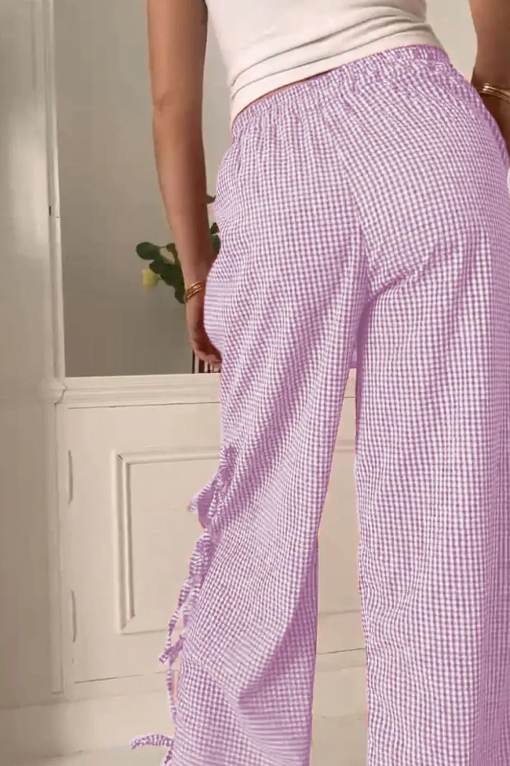 Lilac gingham wide-leg pants with side tie detail and ruffled pocket trim