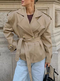 Khaki double-breasted belted trench coat with notch lapels and gold button front