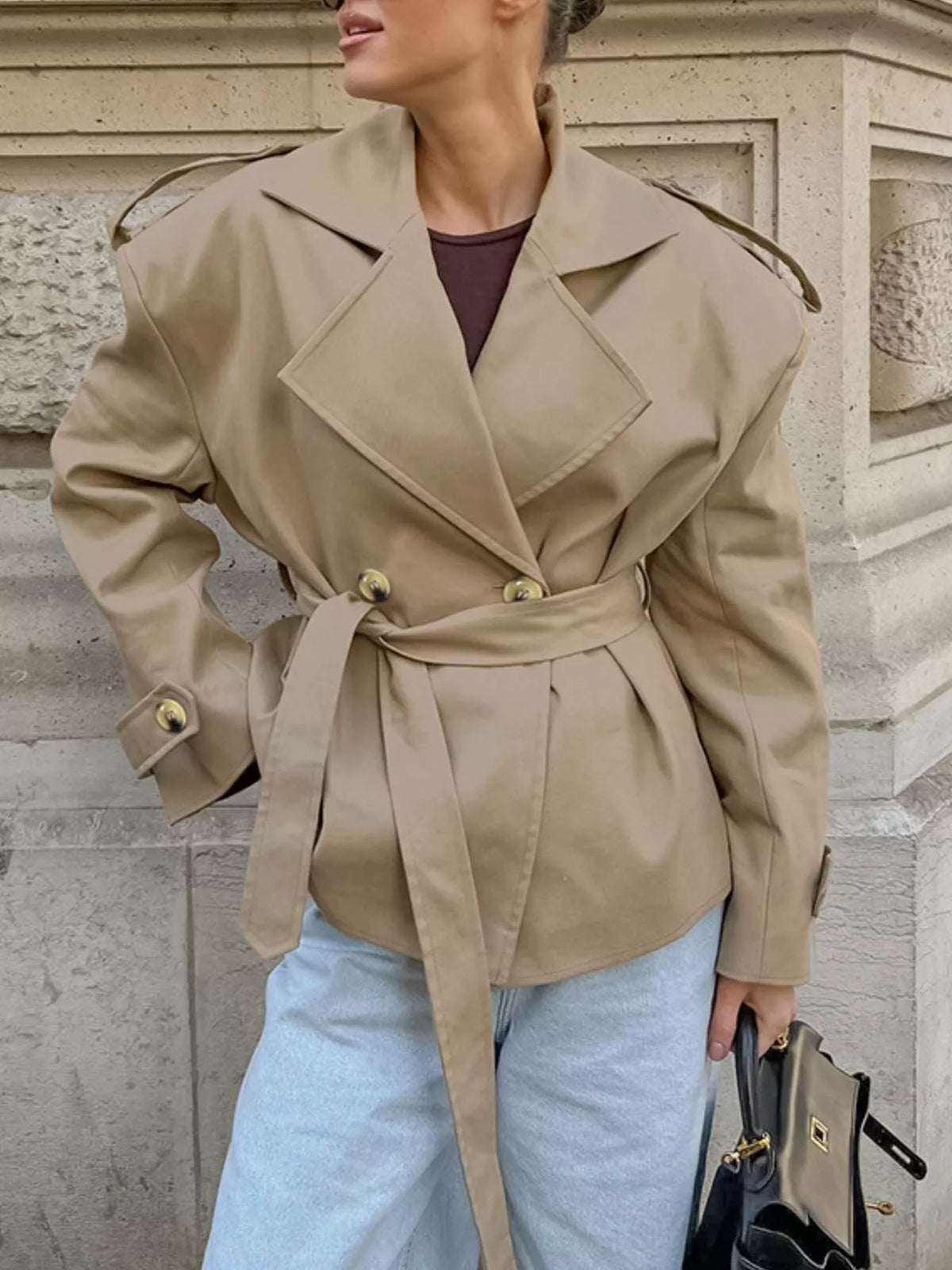 Khaki double-breasted belted trench coat with notch lapels and gold button front