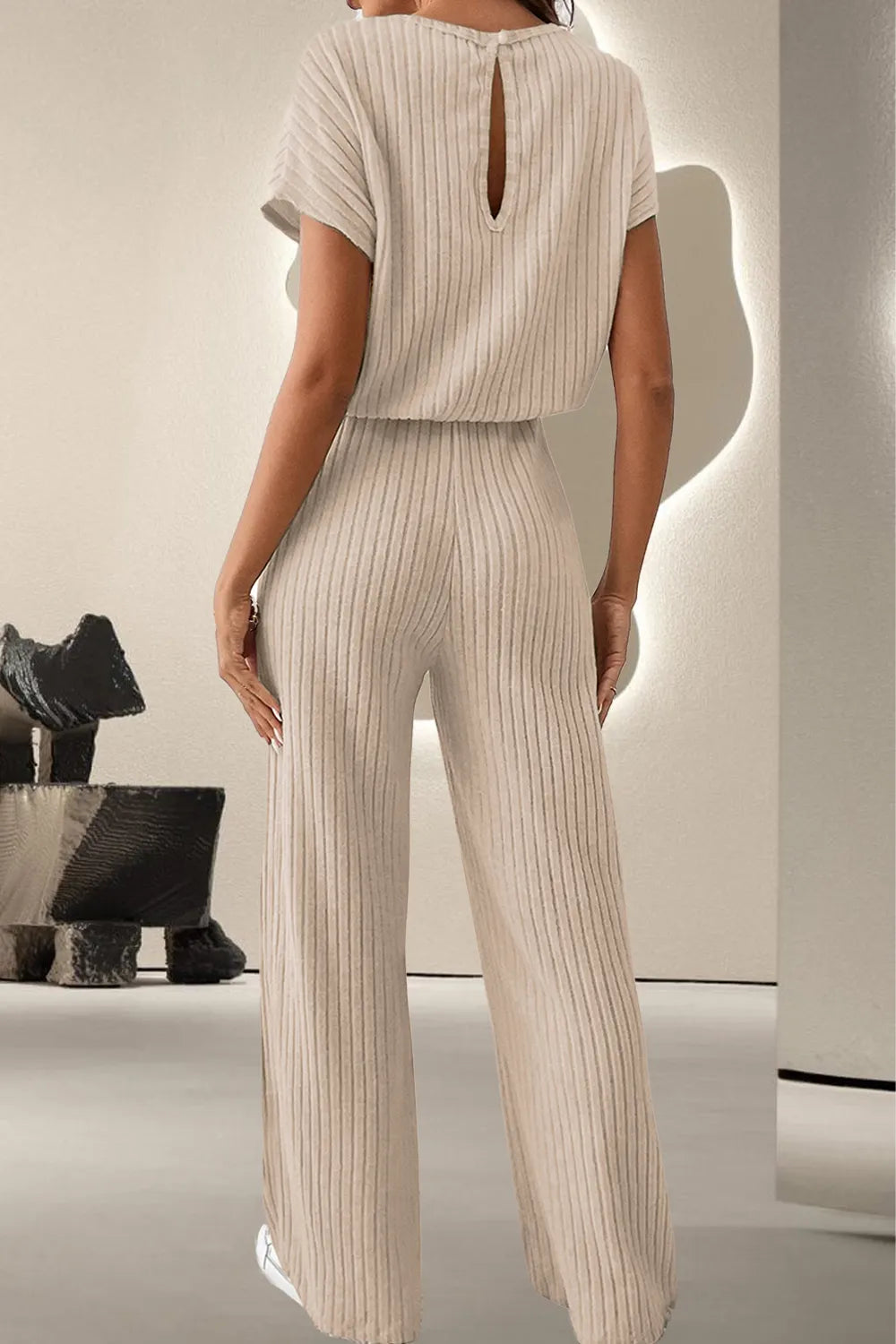 Cream ribbed round-neck short-sleeve jumpsuit with wide legs