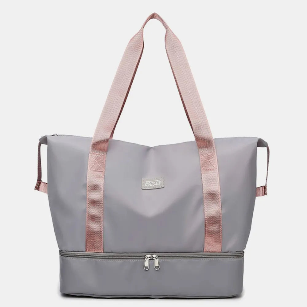 Gray nylon duffel bag with rose handles and front logo label