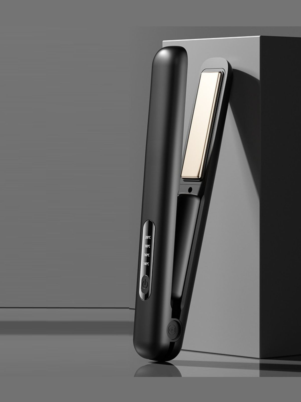 Black portable hair straightener side view with heat control panel and power button