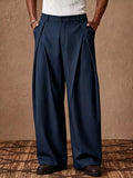 Men's pleated wide-leg high-waist dress pants in navy, pleated front, relaxed fit.