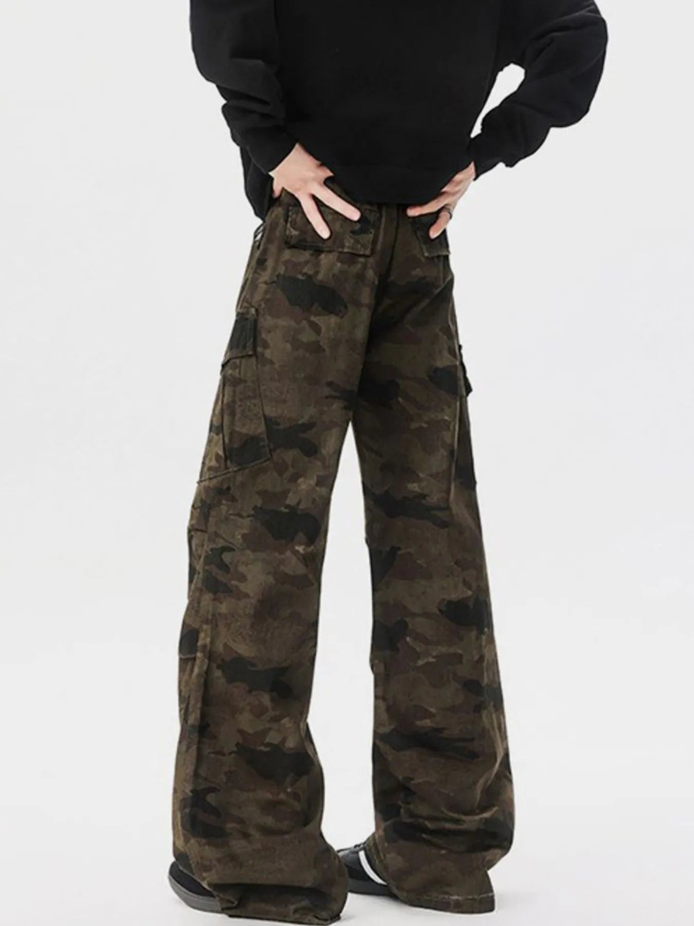 Camouflage wide-leg cargo pants with two back flap pockets and black waistband belt