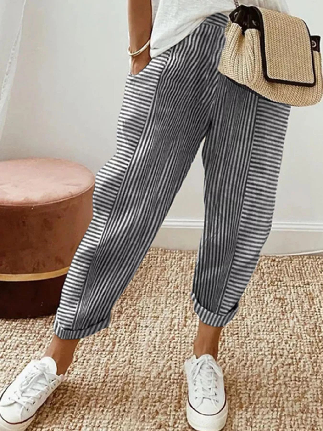 Striped casual pants with pockets, black and white vertical stripes, ankle cuffs
