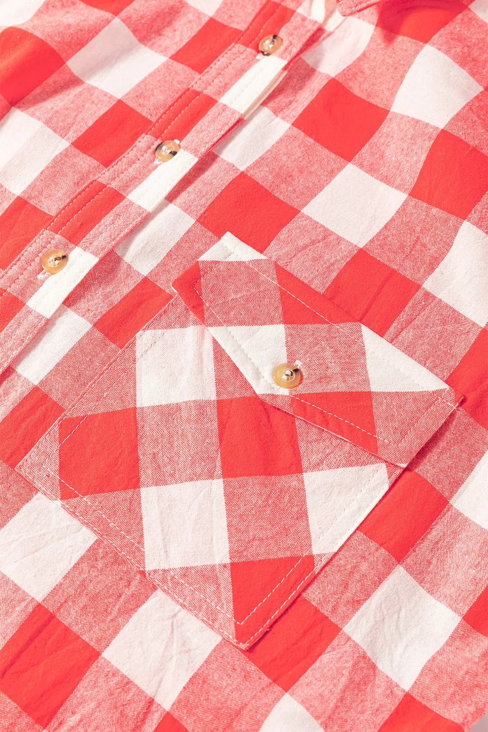 Strawberry plaid shirt dress close-up of button placket and chest pocket