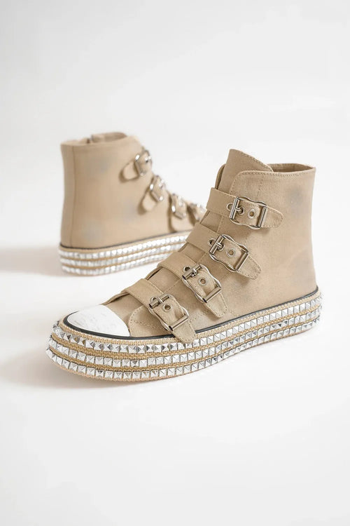 Khaki platform sneakers with studded midsole and multiple buckle straps on high tops