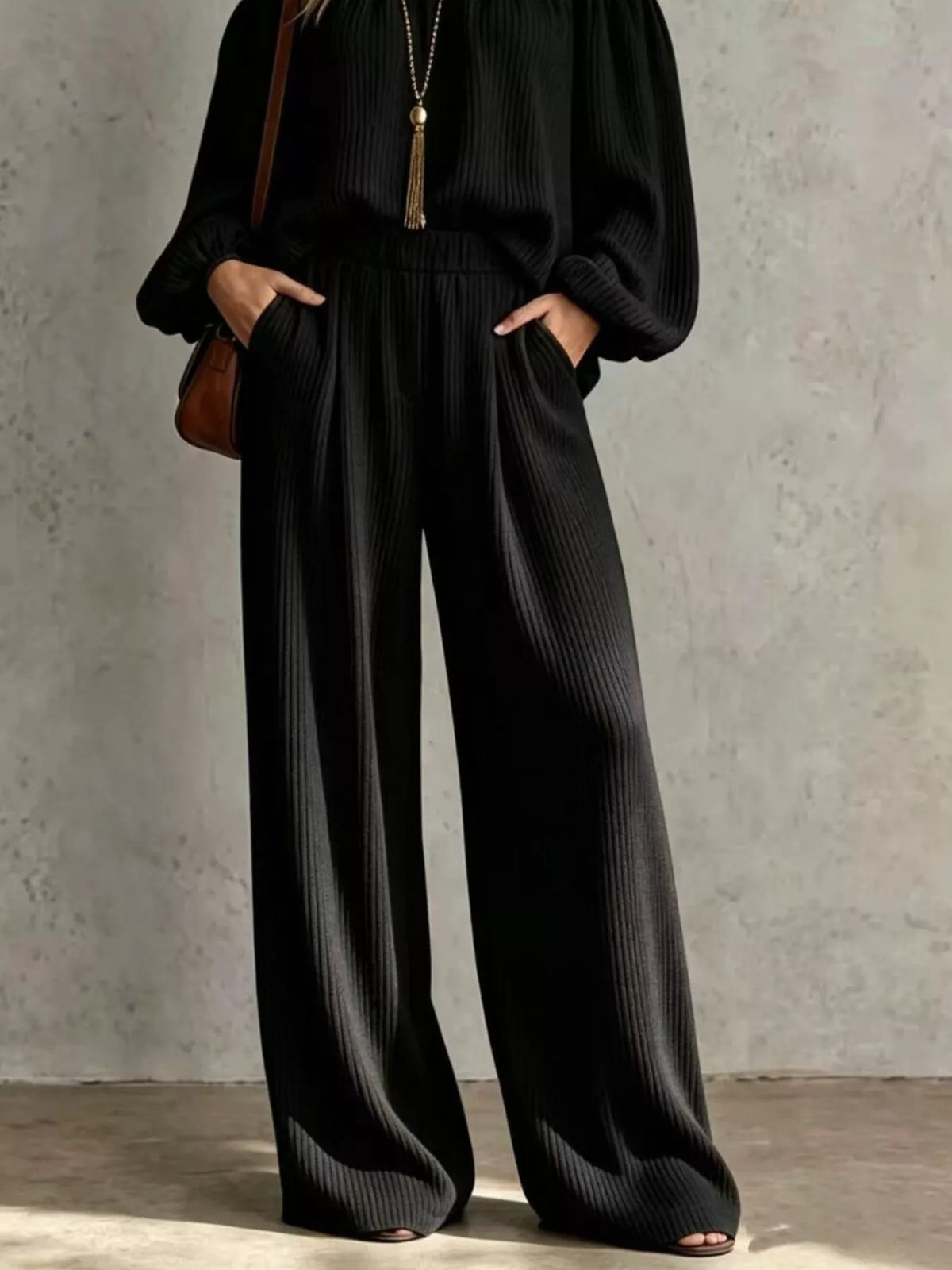 Black ribbed wide-leg pants set with elastic waistband and relaxed fit