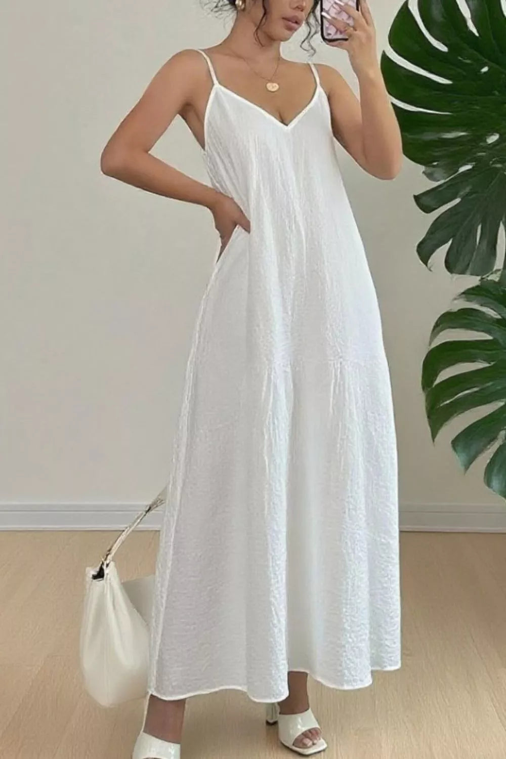 White spaghetti-strap V-neck maxi dress with draped, textured bodice and skirt