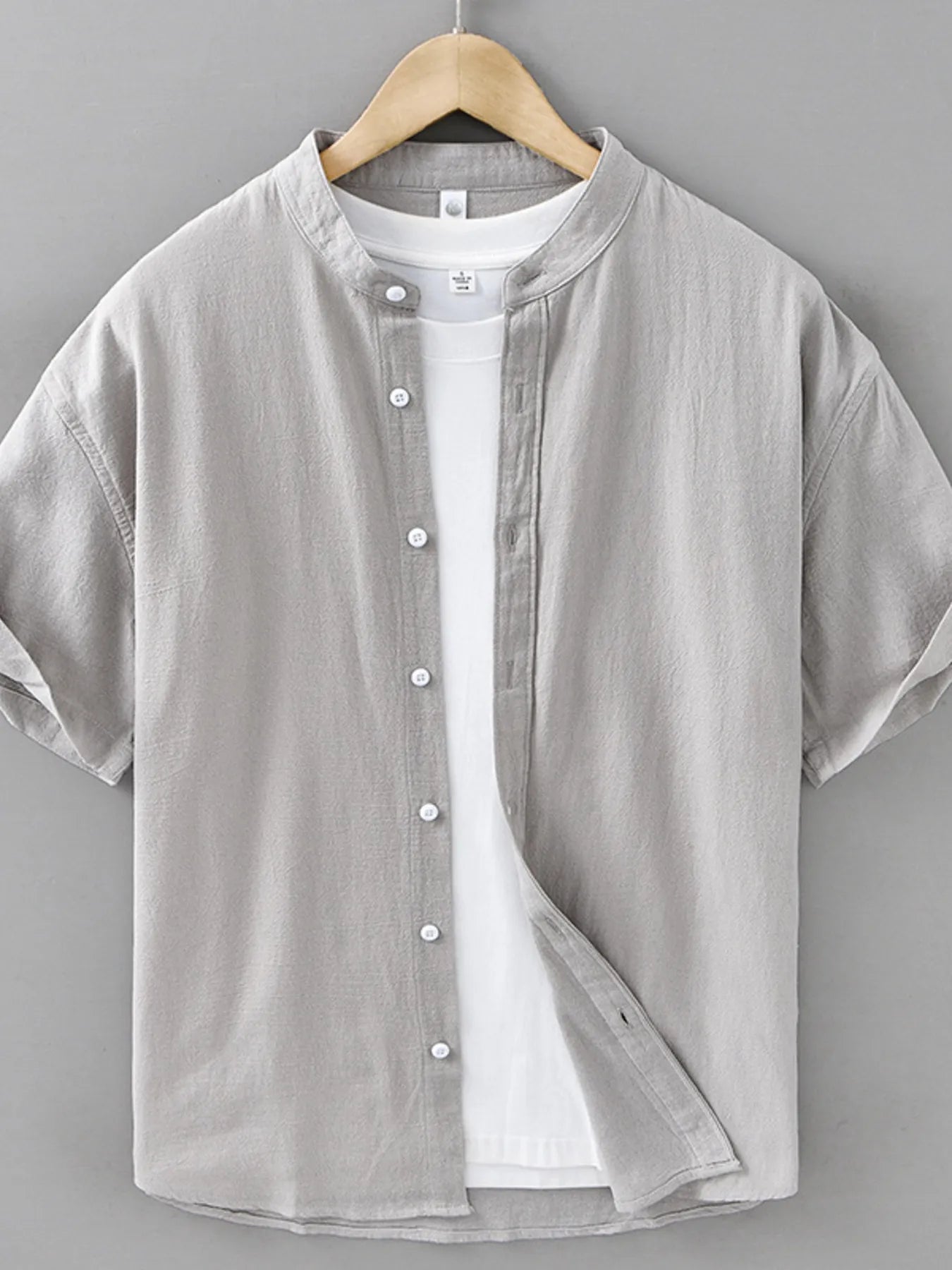 Light gray plus size button-up short sleeve shirt with button front placket