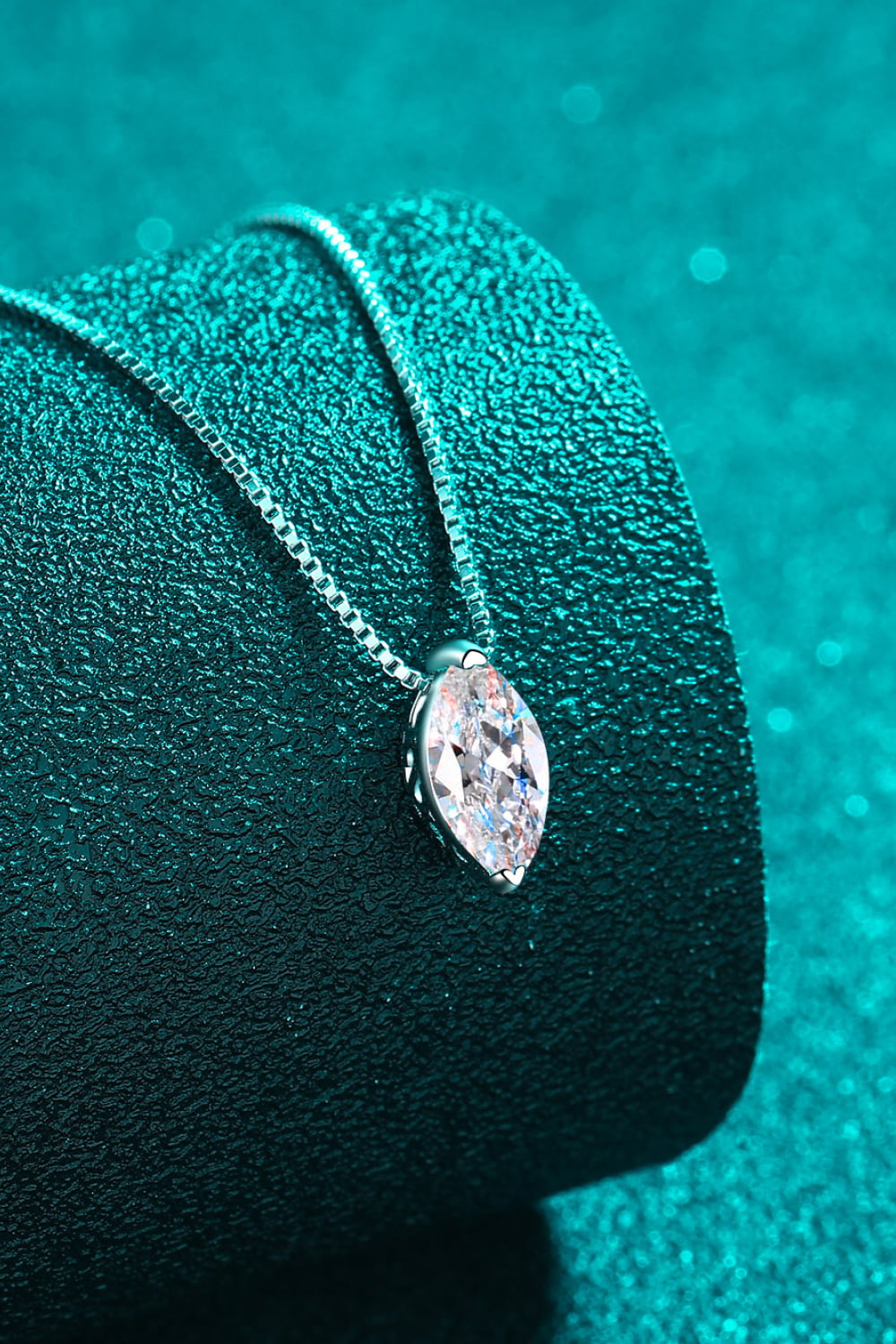 Sterling silver moissanite pendant with marquise center stone and bezel-prong frame