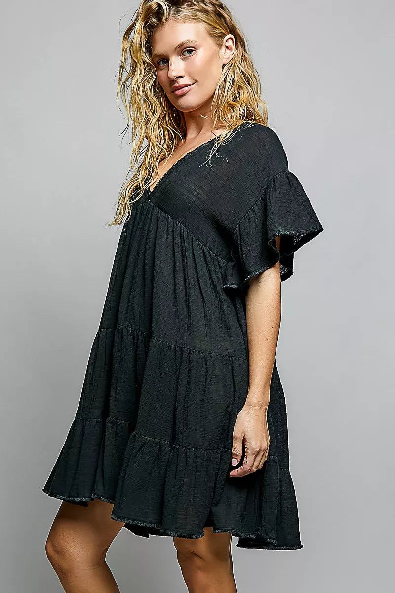 Black cotton V-neck short-sleeve dress with tiered ruffles and shirred bodice