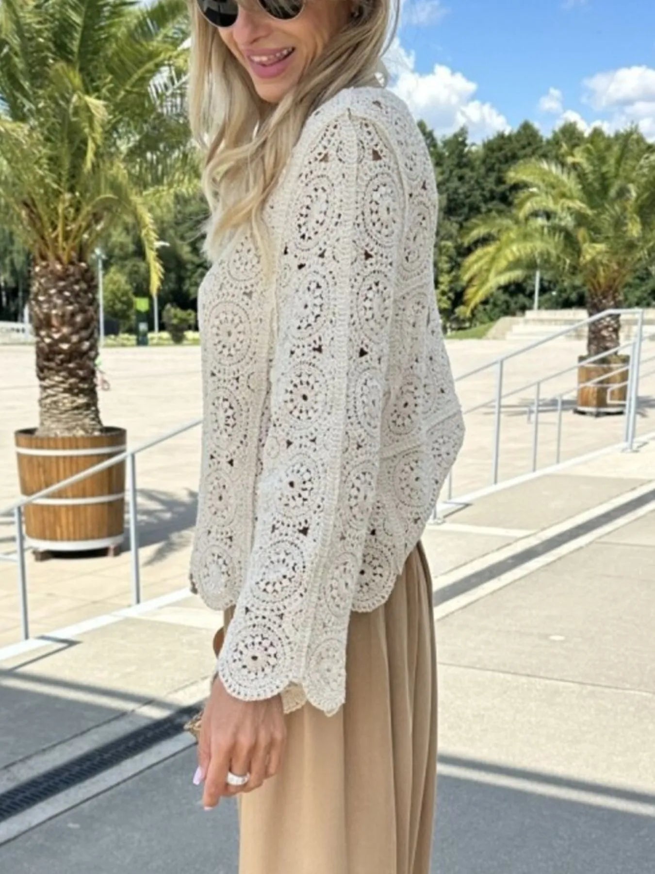 White crochet lace knit top featuring V-neck and allover circular crochet motifs