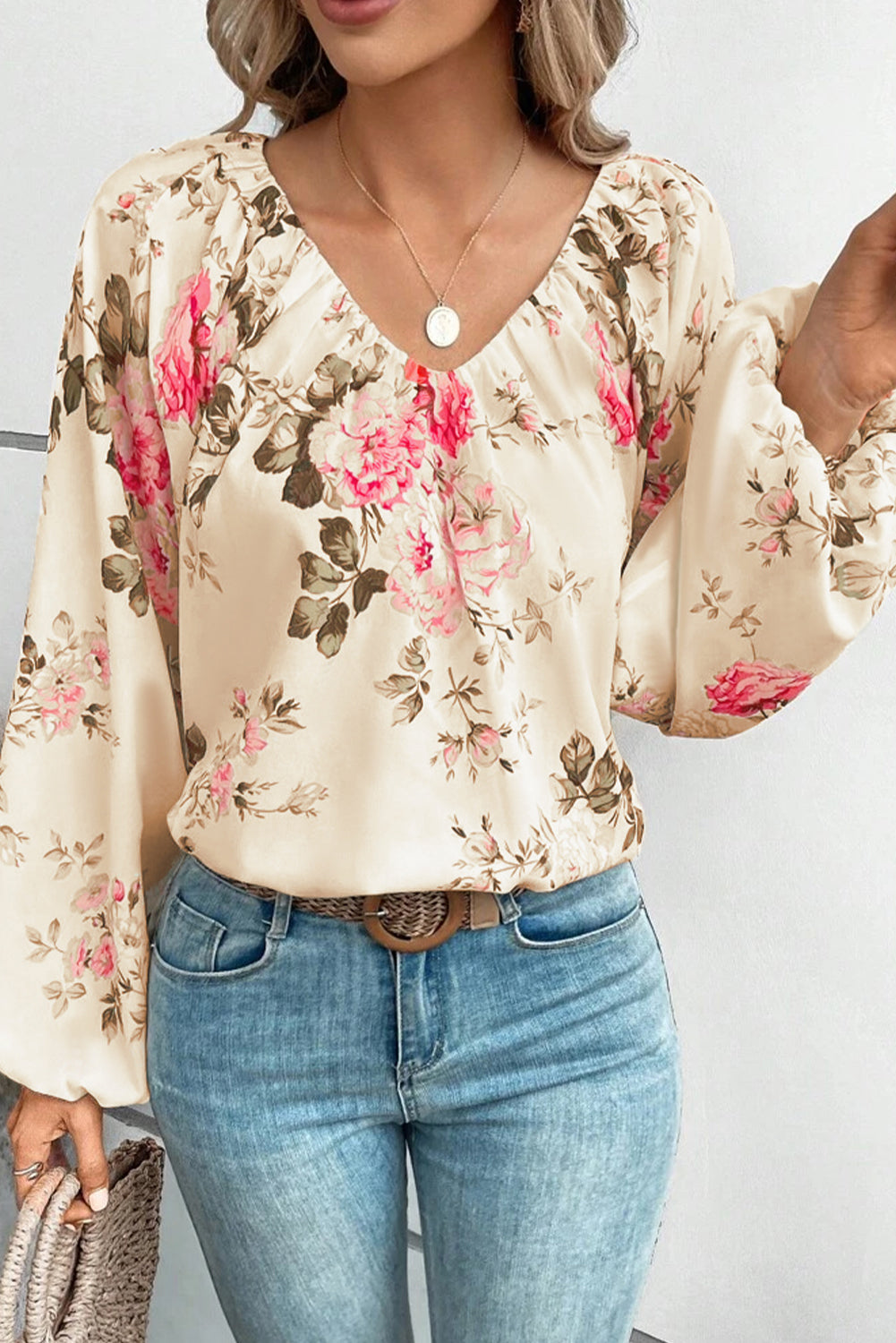 Beige floral V-neck blouse with soft gathered shoulders and long balloon sleeves