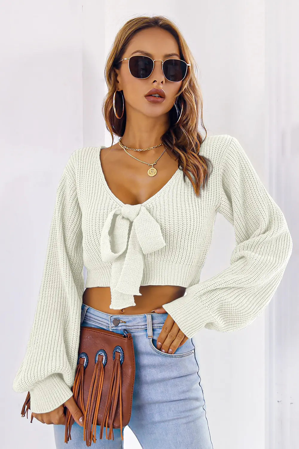 Cream knit bow V-neck cropped sweater with long sleeves