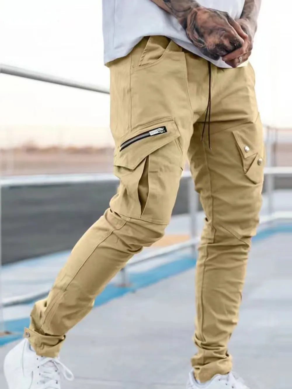 Men's plus size cargo pants in tan with side cargo pockets and flap details