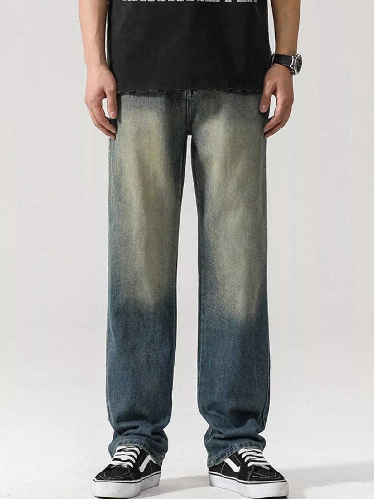 Men's washed teal denim jeans with wide-leg fit, front pockets, and button fly