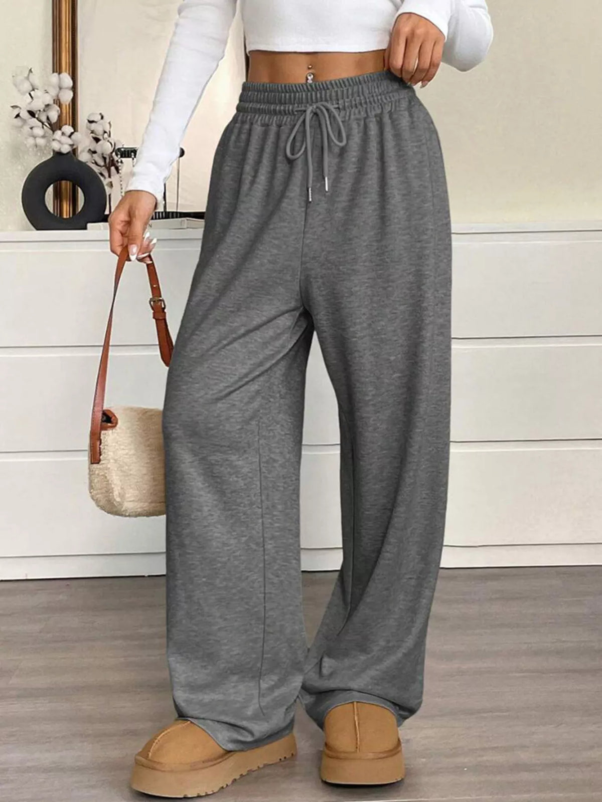 Women's high-waist drawstring wide-leg pants in dark gray, elastic waist with ties.