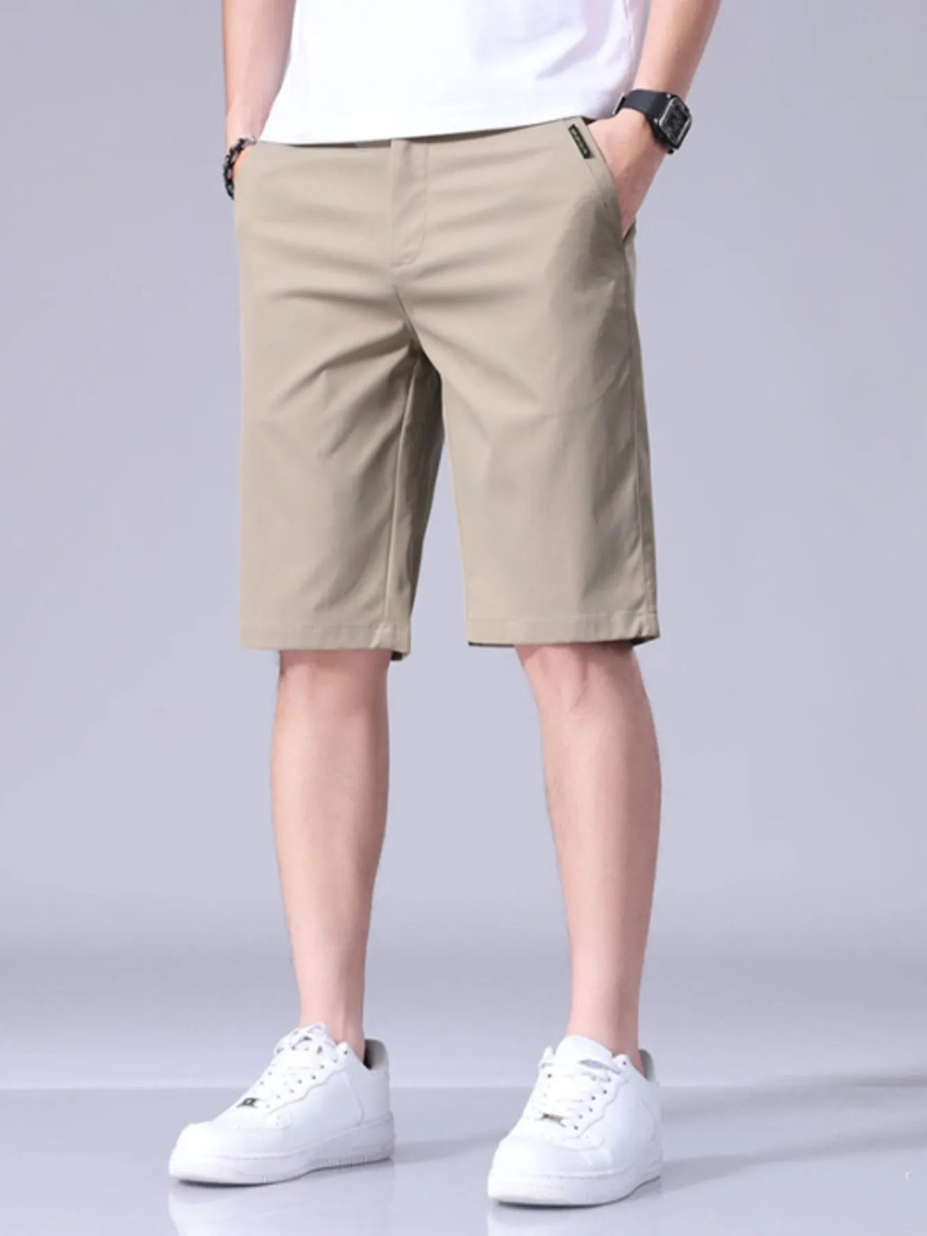 Khaki men's casual shorts with pockets, belt loops, and button closure
