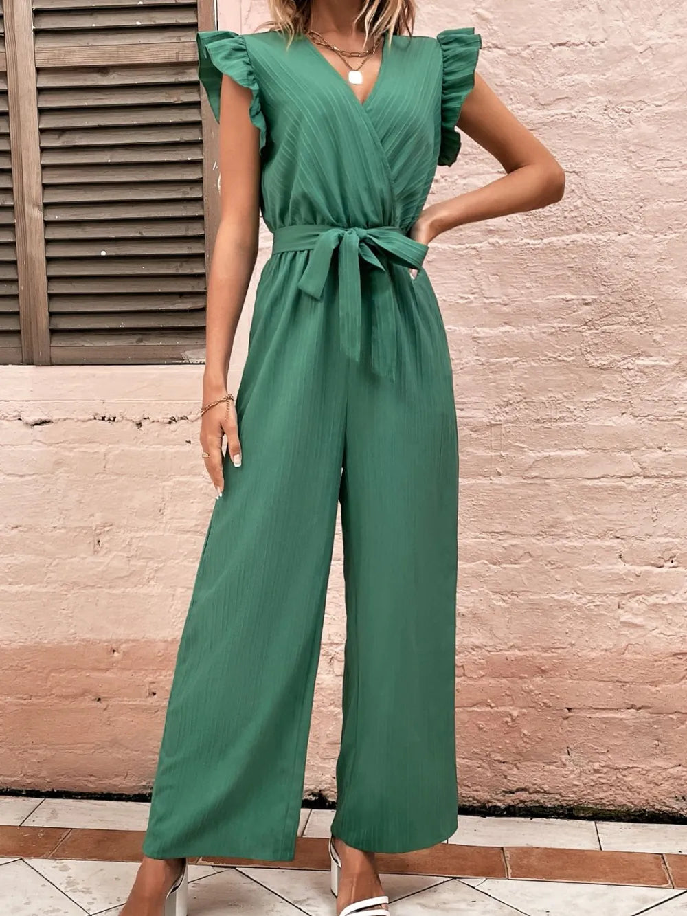 Ruffled surplice cap-sleeve jumpsuit, dark green with V neckline and ruffled shoulders