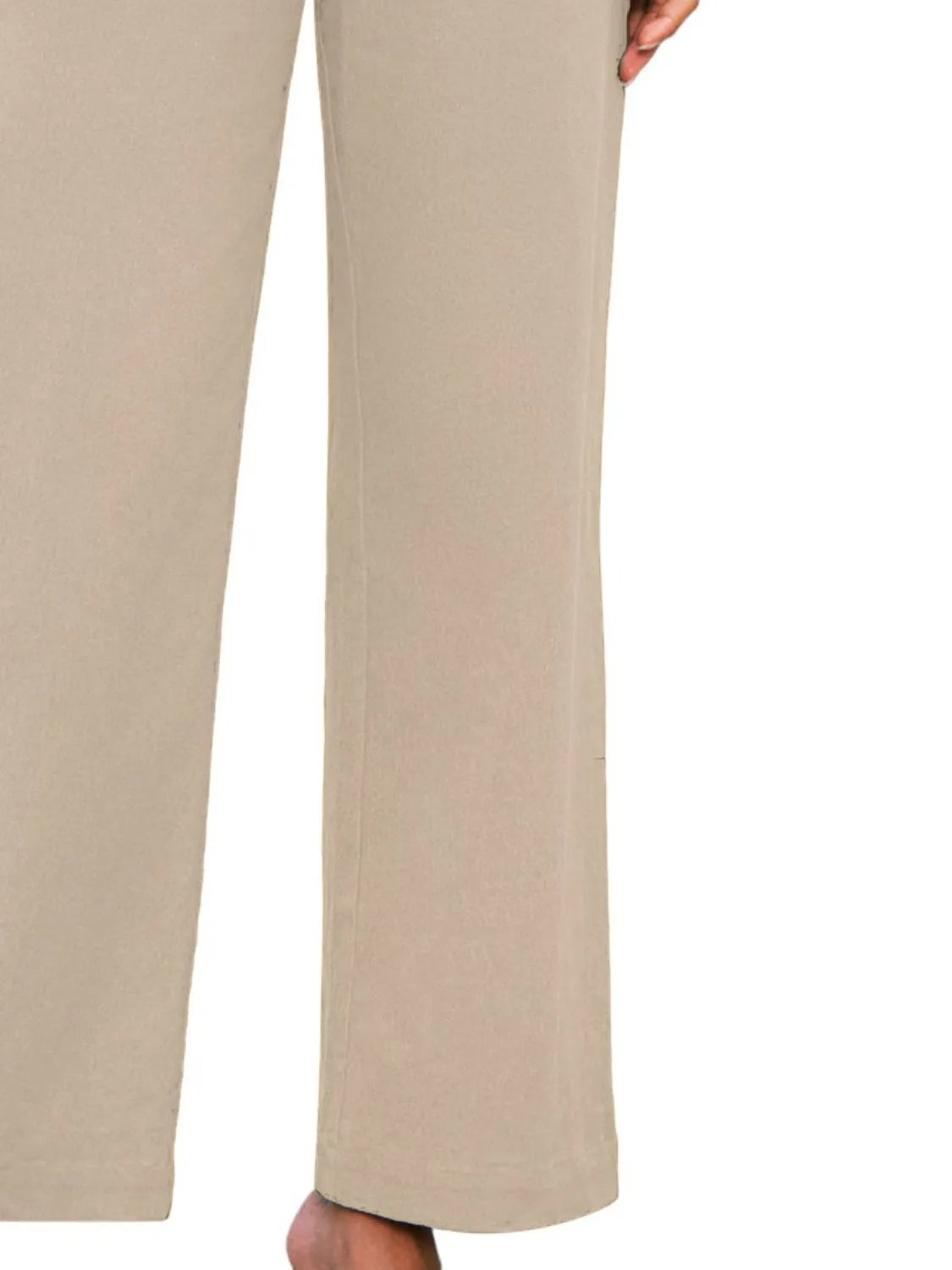 Beige wide-leg pants with high waist and straight, relaxed drape