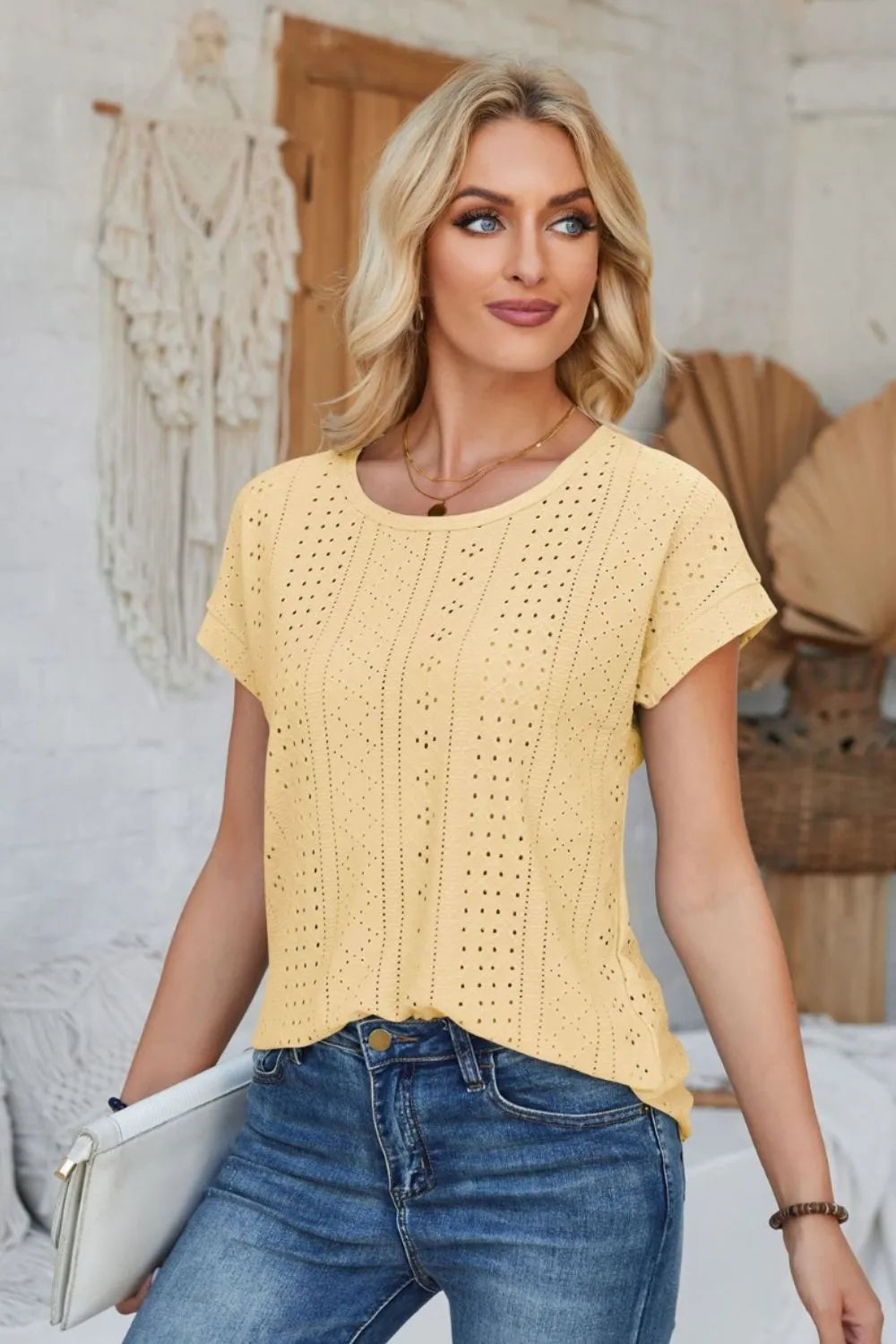 Light yellow eyelet short-sleeve T-shirt with round neck, front view