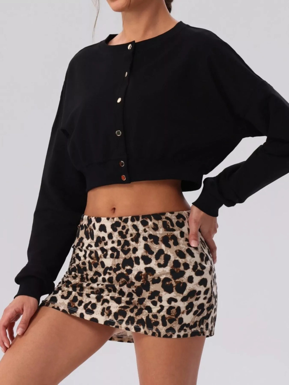 Black cropped button cardigan with long sleeves and front button placket