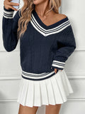 Dark blue V-neck sweater with contrast striped neckline and ribbed cuffs