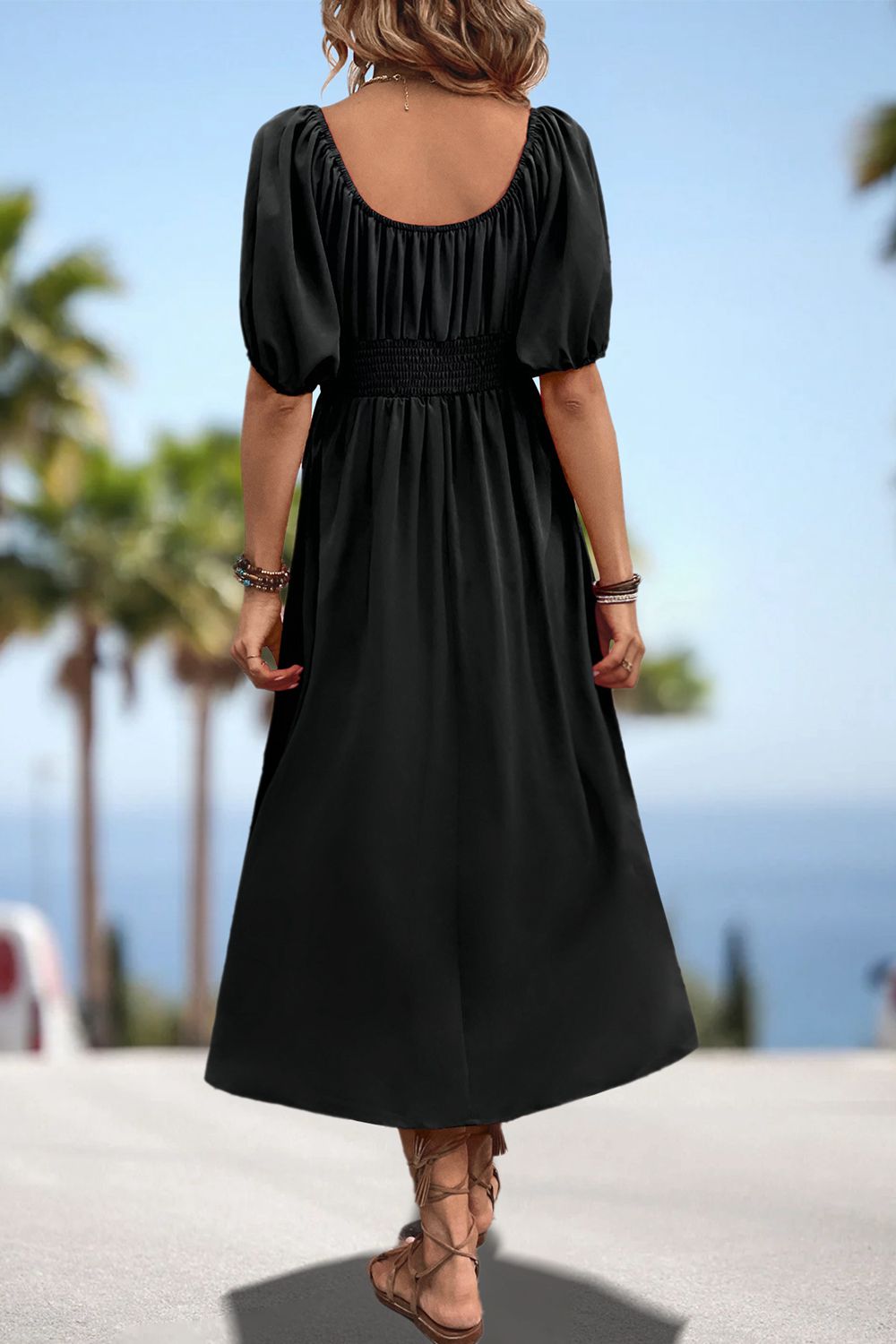 Black smocked waist midi dress with puff sleeves and gathered back yoke
