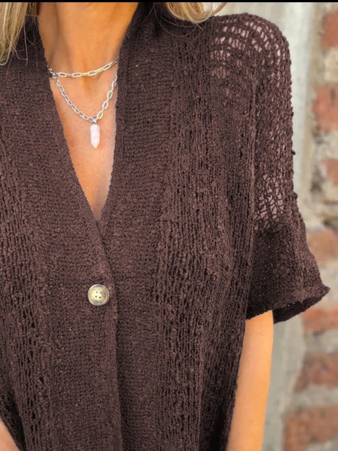 Dark brown one-button openwork cardigan with V-neck and short sleeves, textured knit