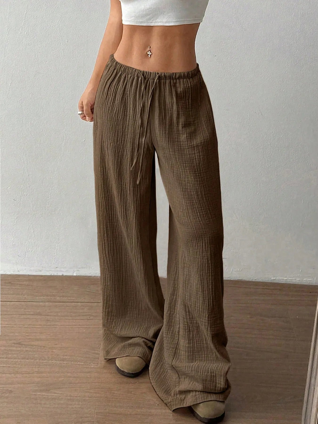 Khaki wide-leg drawstring pants with elastic waist and loose drape