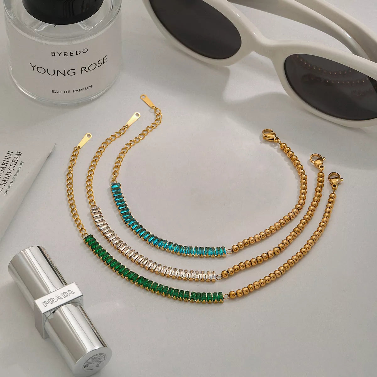 Gold-plated chain bracelet with turquoise and green beaded rhinestone strands