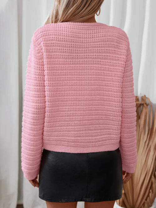 Dusty pink knit cardigan back view with long sleeves and ribbed hem
