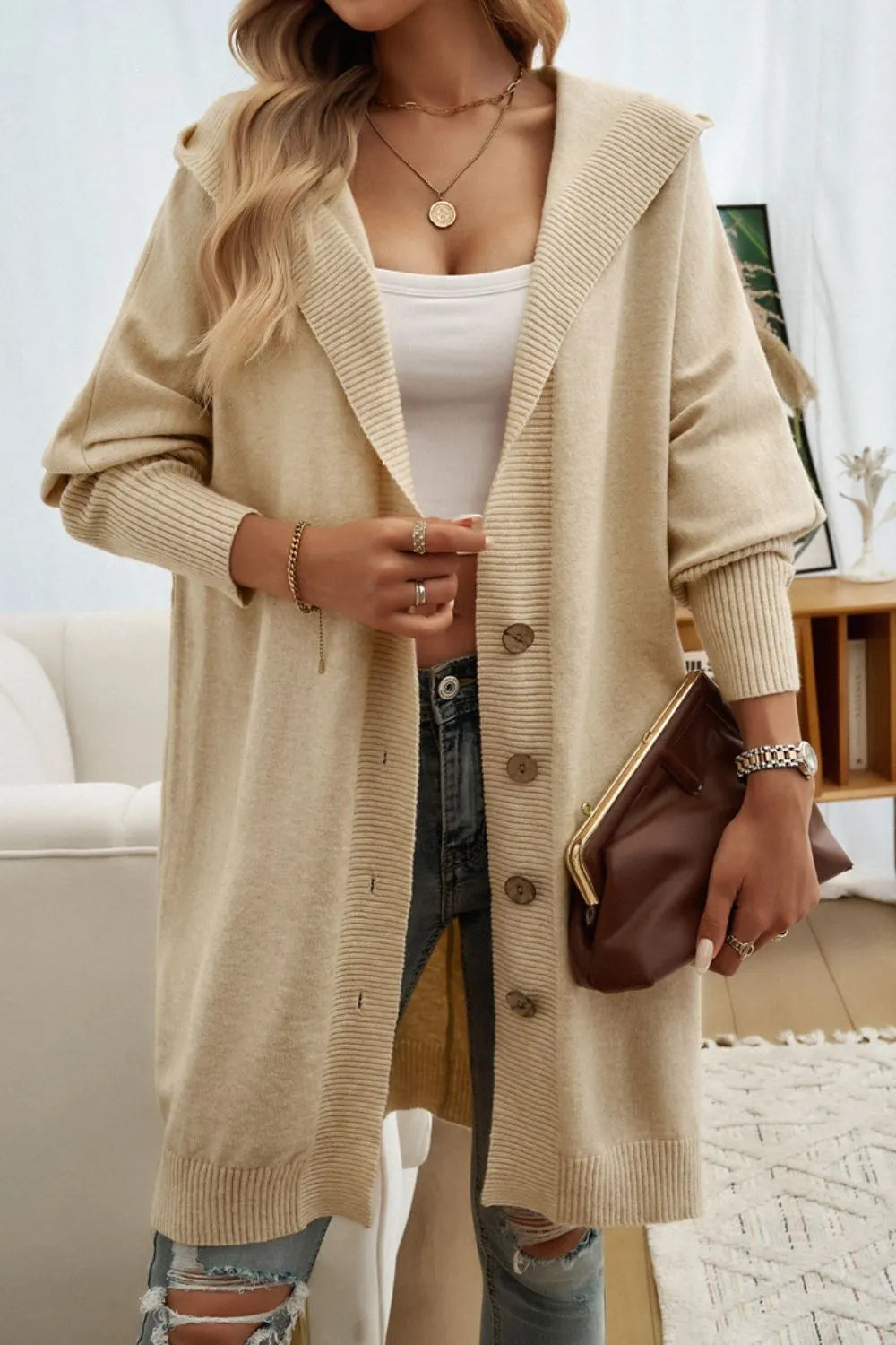 Tan hooded button-up long cardigan with ribbed knit and long cuffed sleeves.