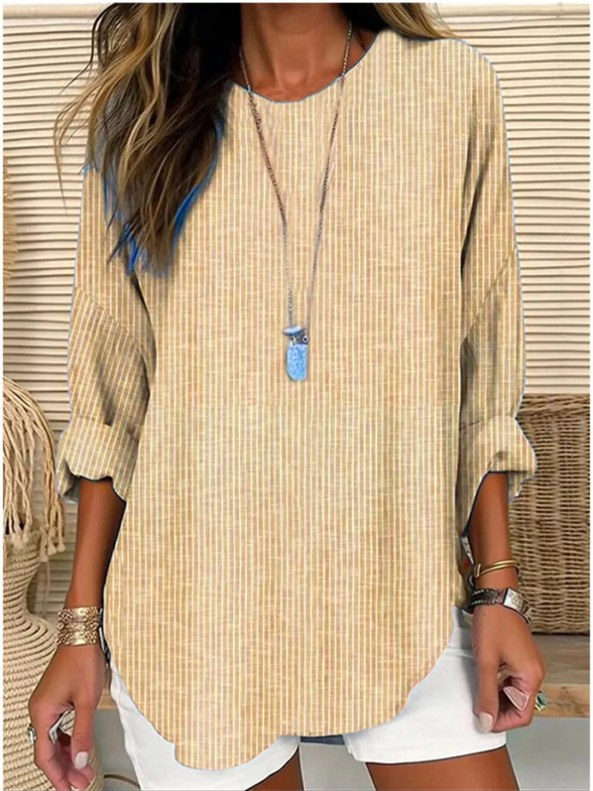Women's striped long-sleeve blouse in light yellow with split neckline