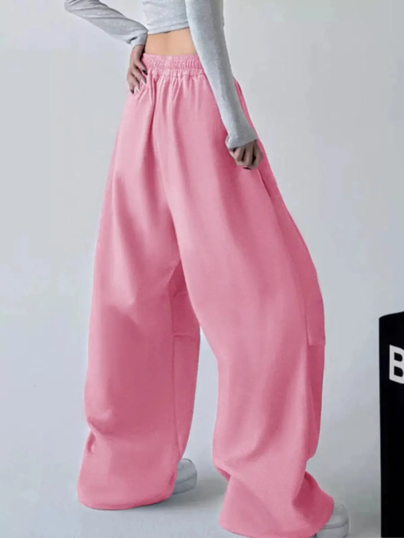 Pink oversized wide-leg drawstring pants, loose fit with elastic waistband