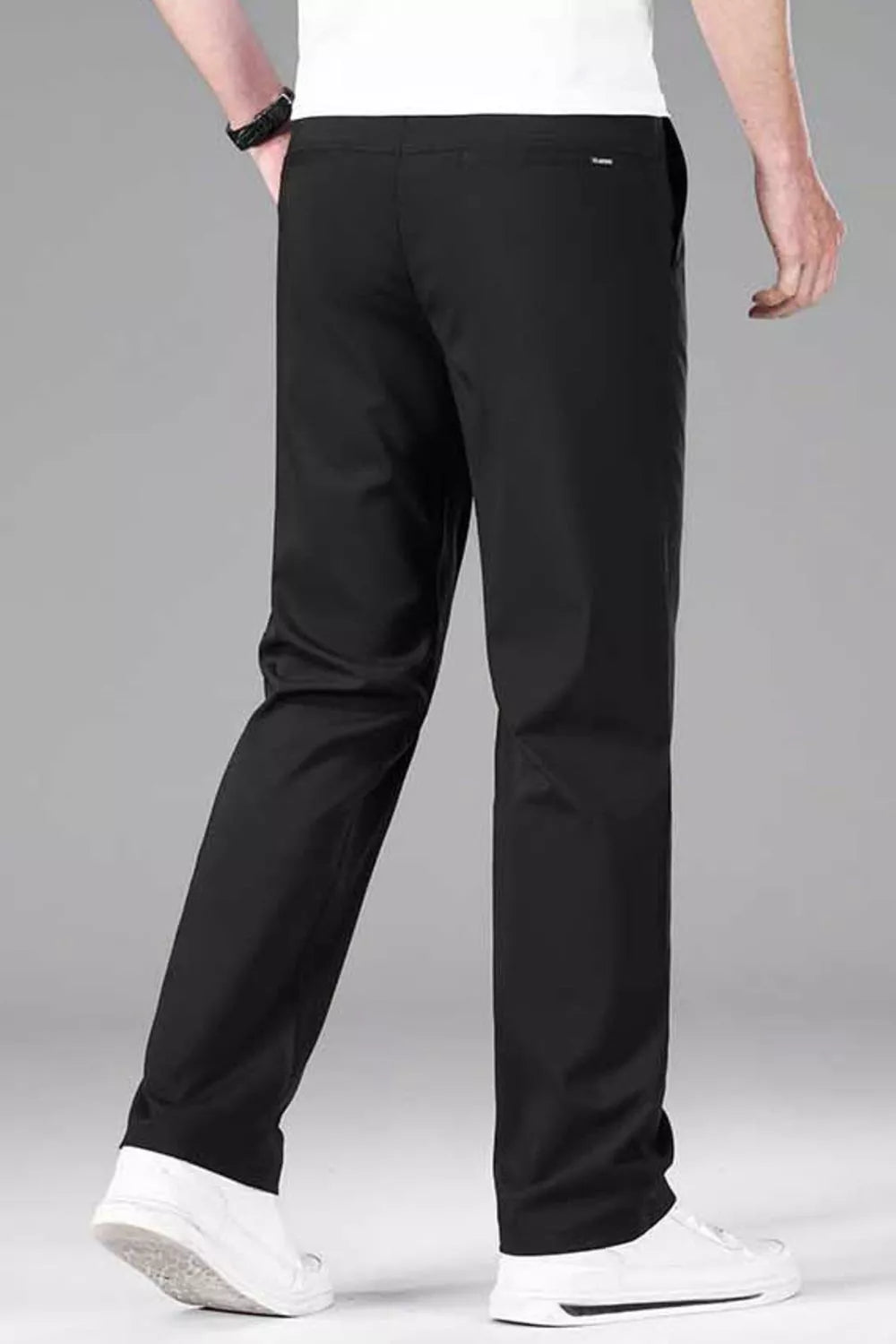 Black straight-leg casual pants with stretch fit and side seam details