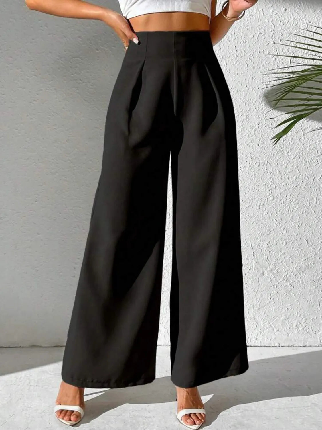 Black wide-leg high-waist pants with smooth waistband and wide drape legs