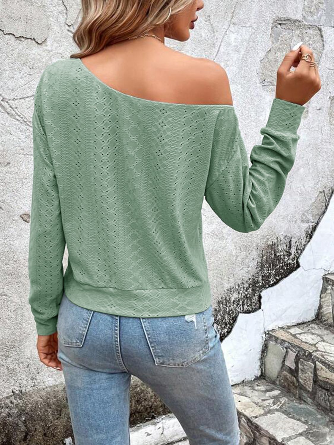 Light green eyelet blouse, back view with dropped shoulders and long sleeves