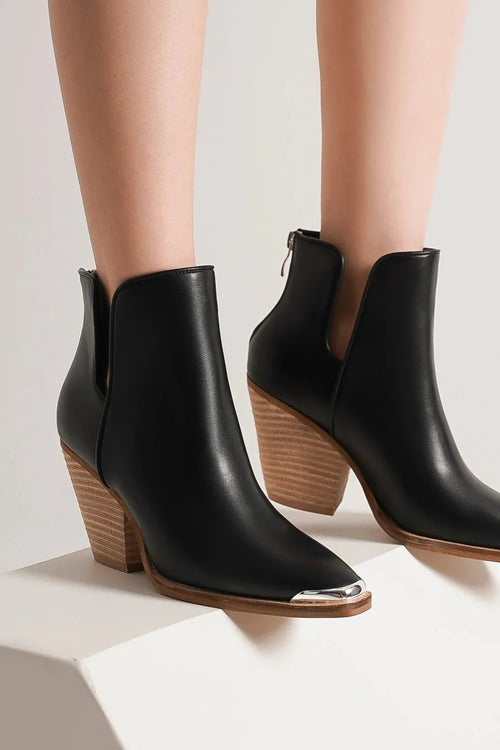 Black ankle boots with pointed metal-tip toe and block heel, elastic side panels