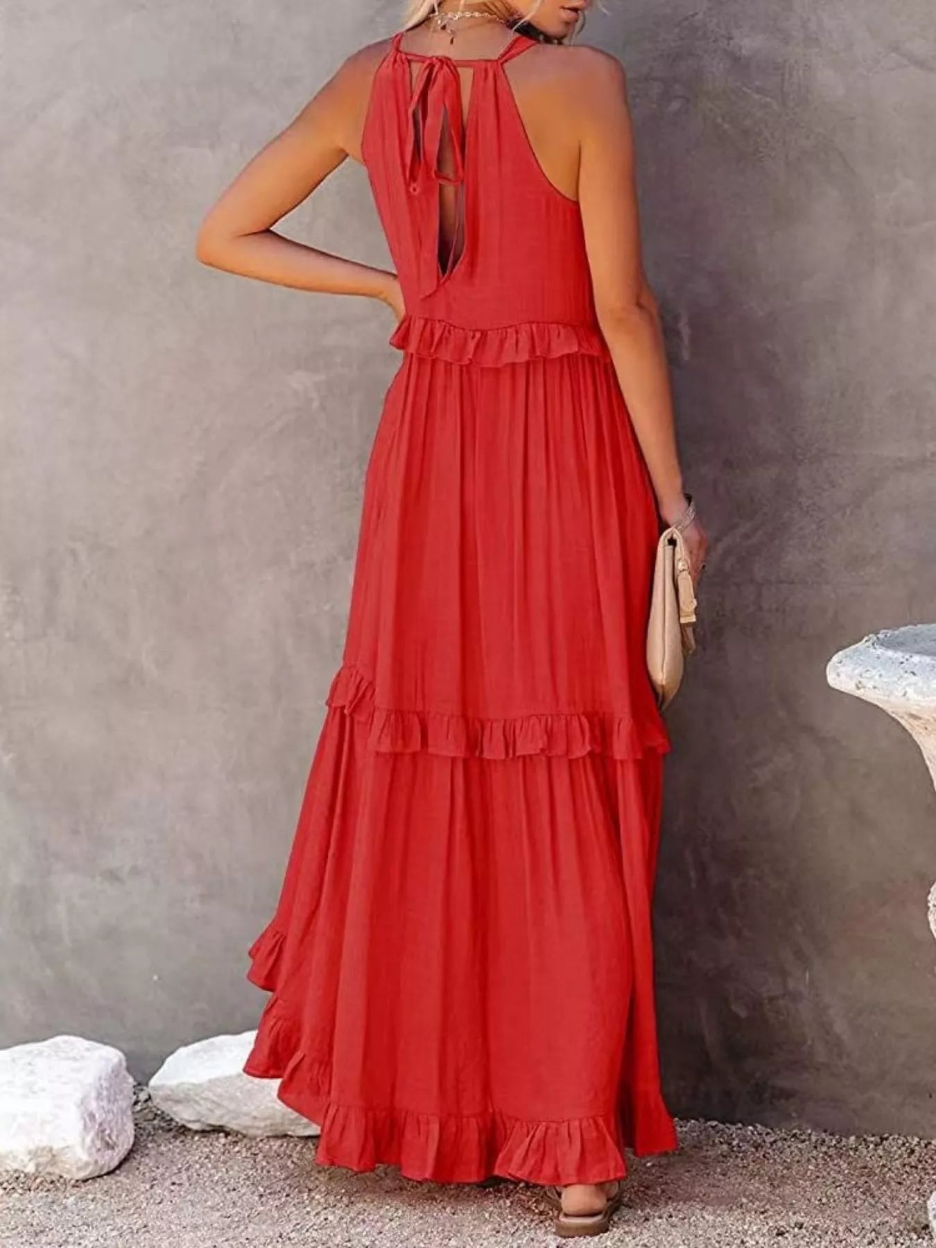 Red ruffled tiered sleeveless maxi dress with halter neckline and layered ruffle hem