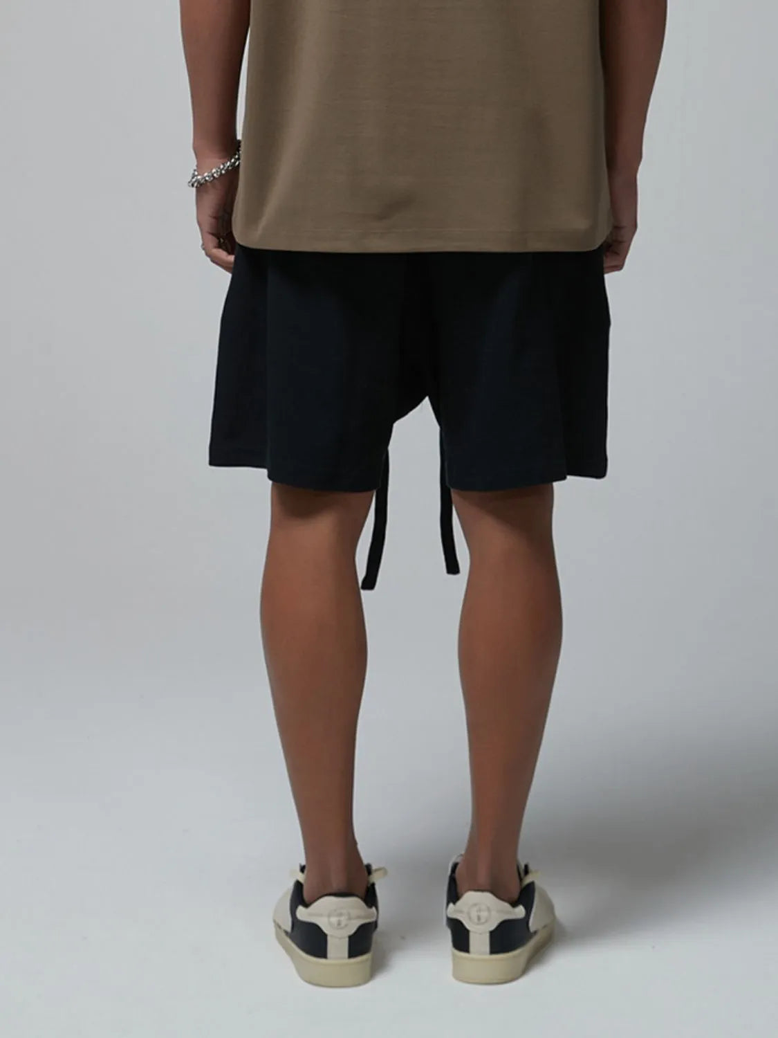 Men's drawstring waffle shorts, dark color, knee-length with adjustable tie and elastic waist.