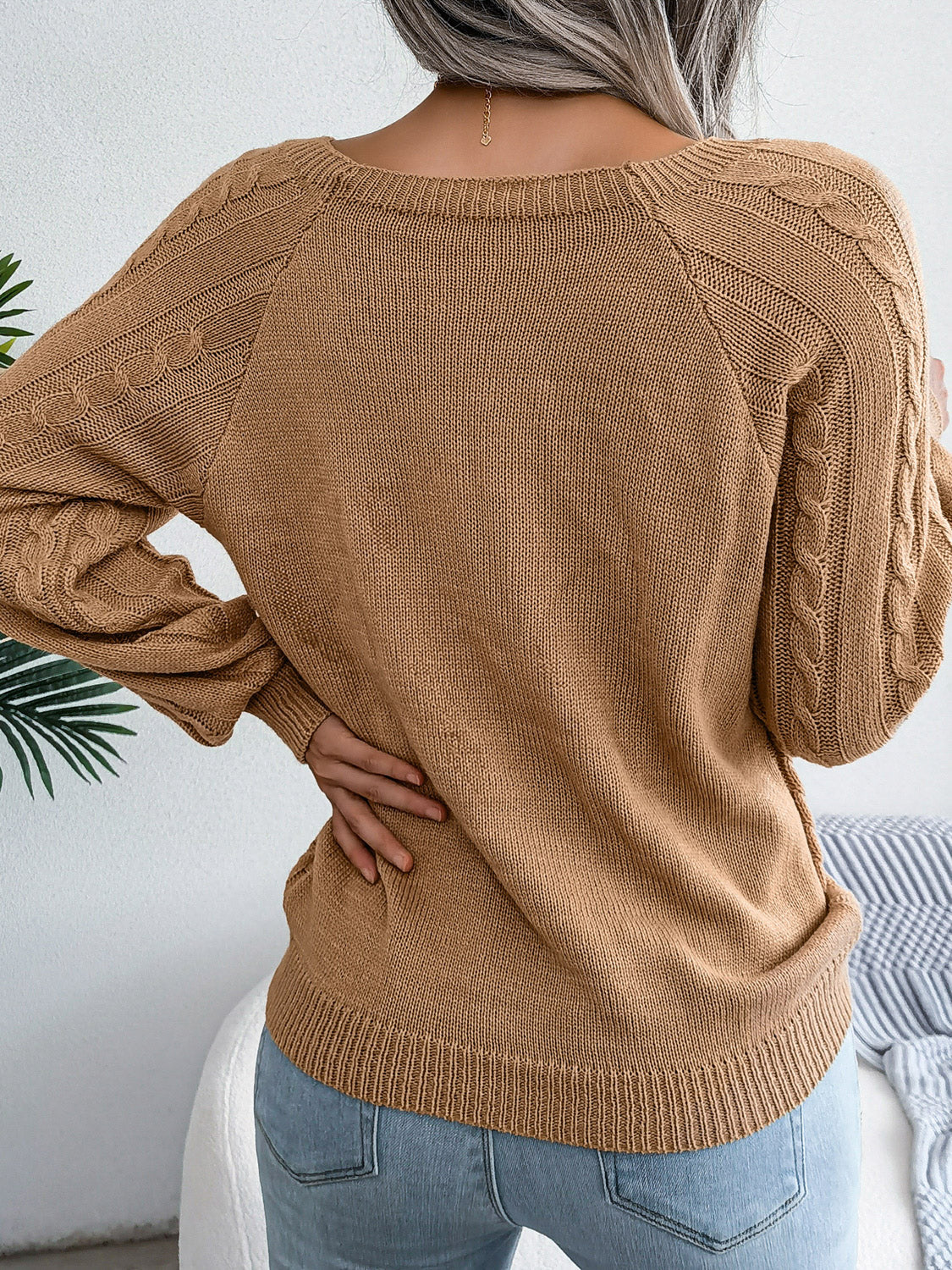 Khaki cable-knit sweater back with diamond-knit panel and decorative button accents
