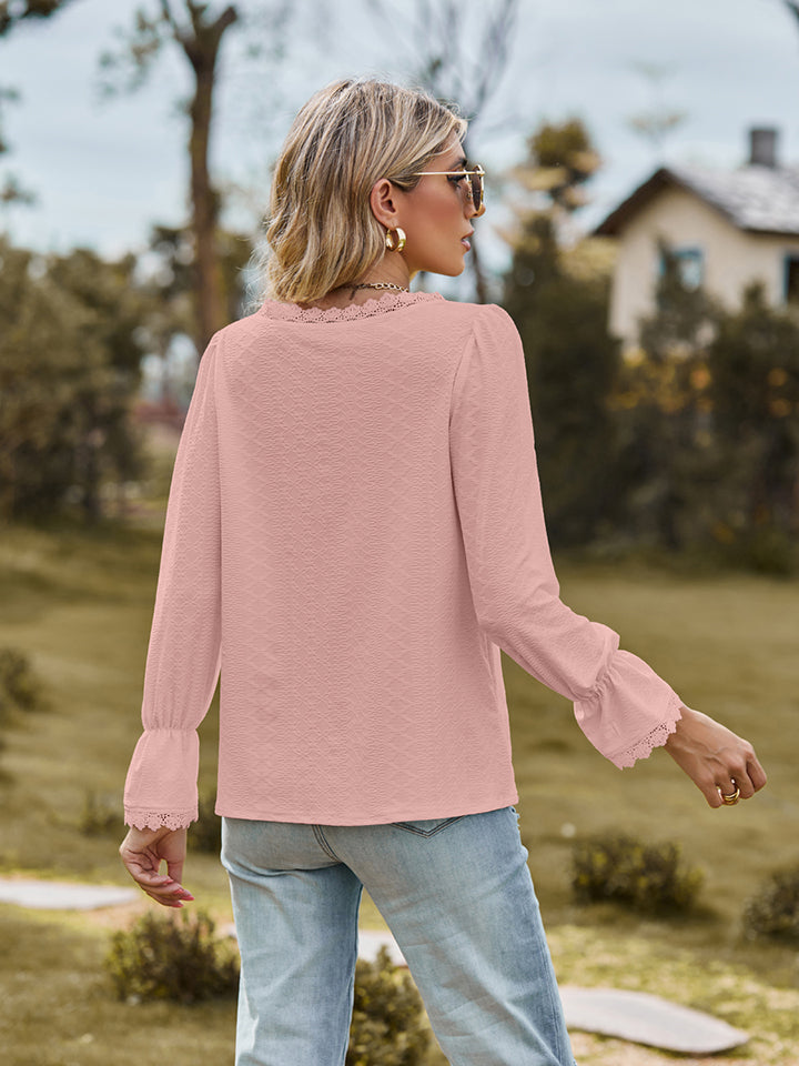 Flounce-sleeve blouse in blush pink, V-neck style with cuffed sleeves, back view