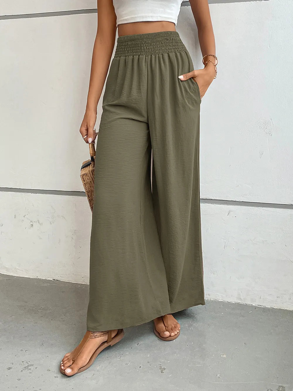 Wide-leg pants in olive green with elastic waistband and loose wide-leg fit