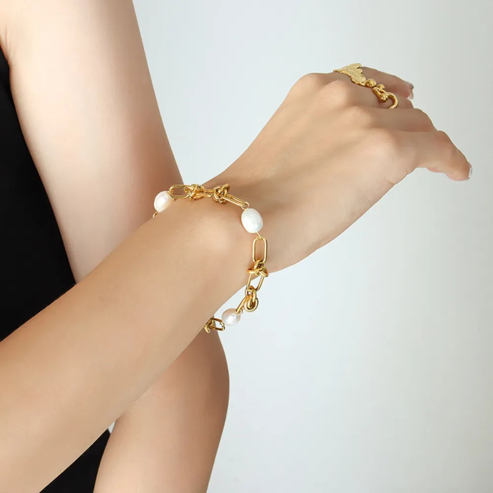 Gold freshwater pearl bracelet with round white pearls and chunky chain links
