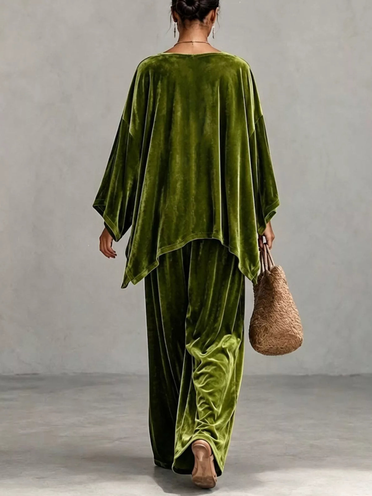 Back view of olive green velvet wide-leg pants with asymmetrical poncho-style top