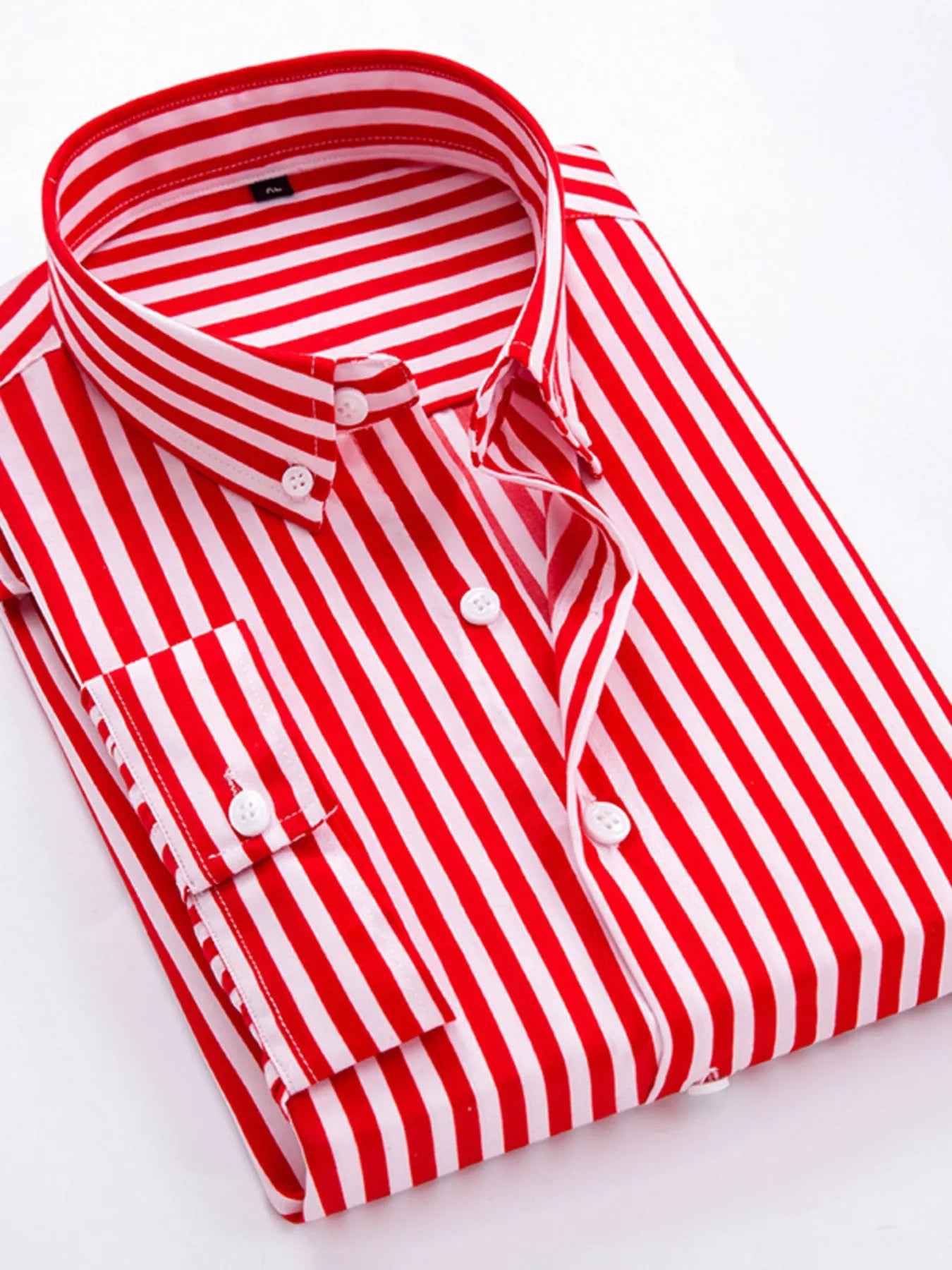 Striped button-up long-sleeve shirt in red and white with white buttons and collar