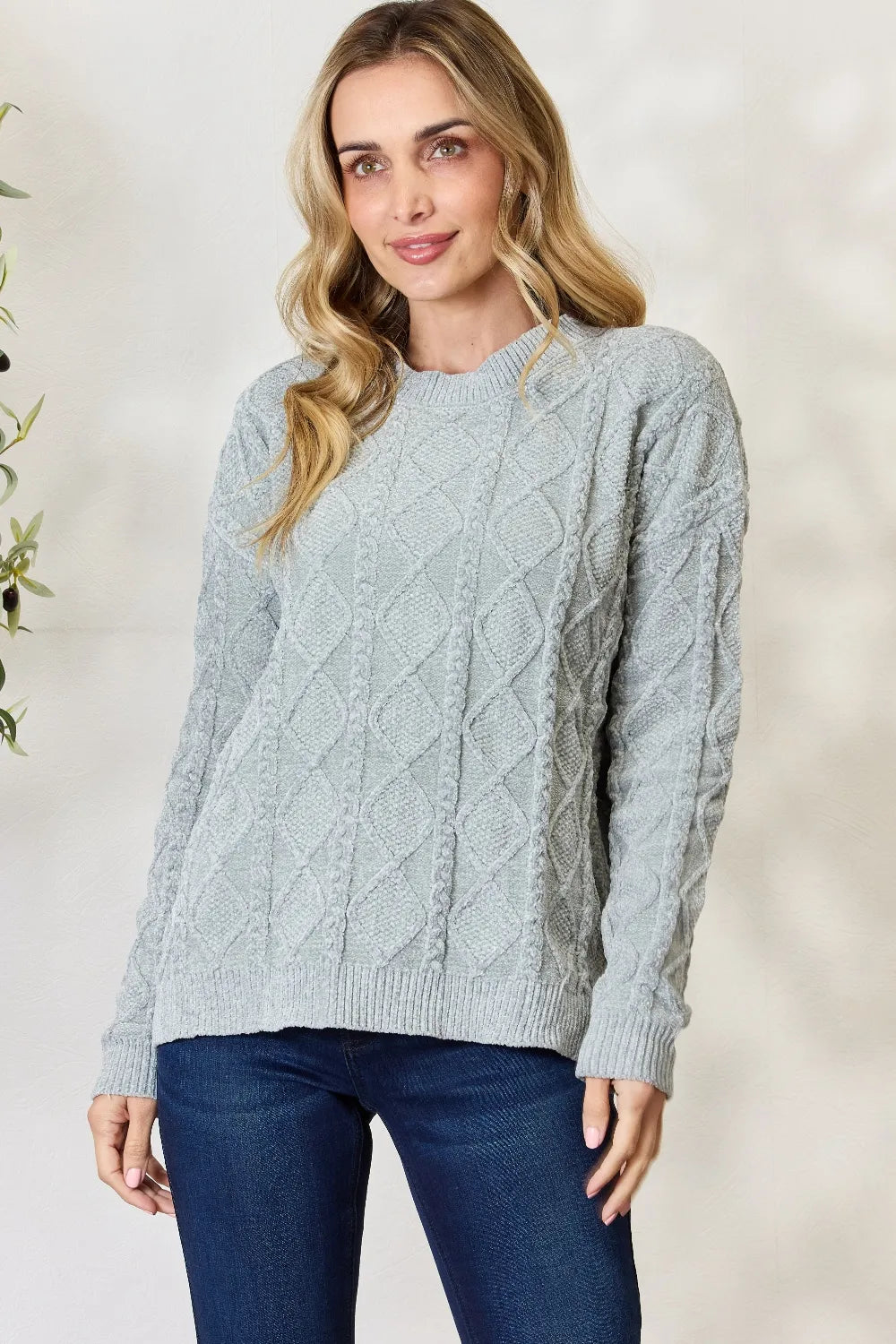 Dust sage cable knit round-neck sweater with textured diamond cable pattern